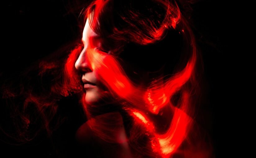 woman with red hair and black eyes